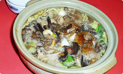A pot dish with plenty of natural mushrooms